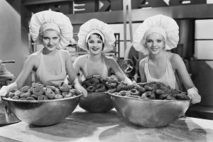 Three ladies taking charge of Food Portions