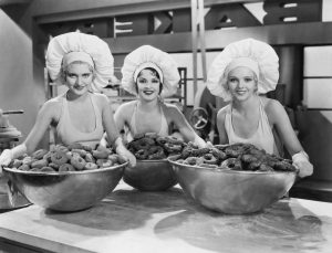 Three ladies taking charge of Food Portions