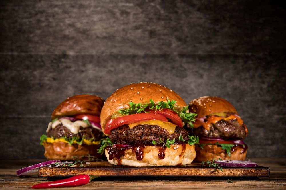 Three separate and small burgers make a trio of taste.
