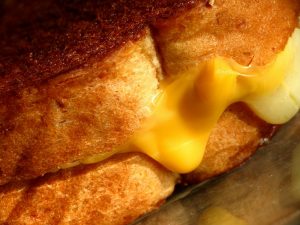 A close up of a large grilled cheese