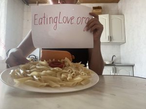 Woman with an Emotional Eating problem enjoying her Food