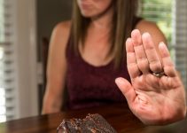 Woman Resisting temtation by not eating Chocolate Cake